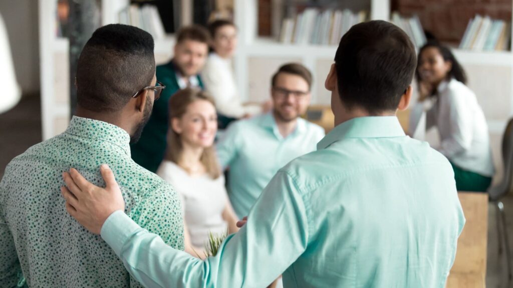 boss introducing a new hire to a group of staff
