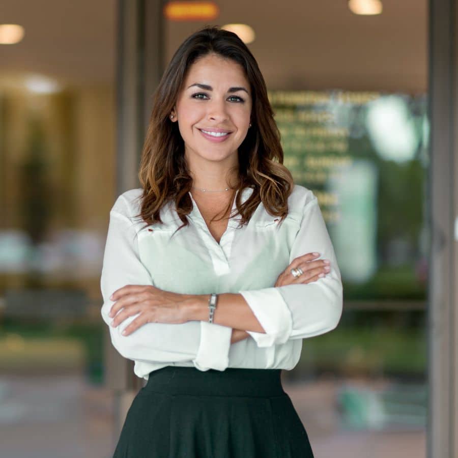 woman smiling with her arms crossed